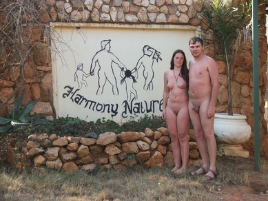 Nudists near resort sign