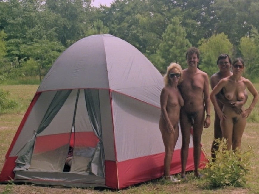 Naturist being naturistic. (Naked) Near a tent