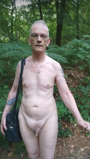 Paul on a naked hike in the woods