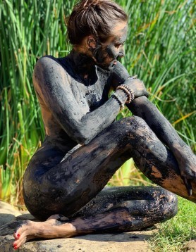 Woman having a mud bath