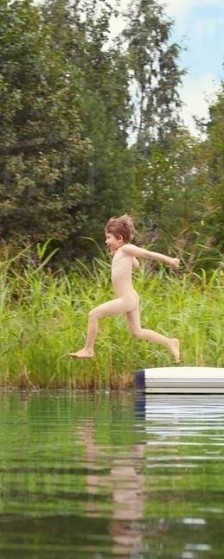 Kid jumping in the water