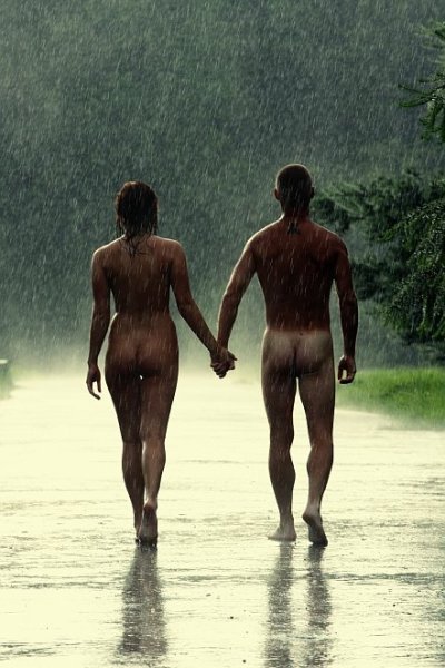 Couple nude in the rain