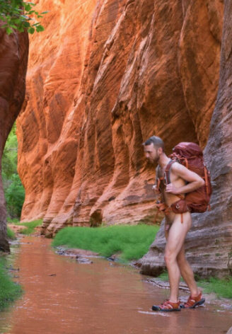 Nude hiker in canyon