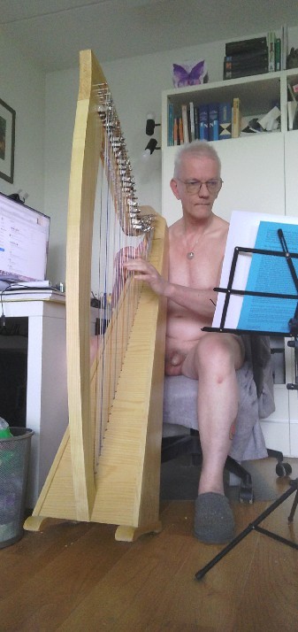 Nude playing the harp