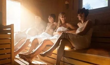 Toweled up people in a sauna