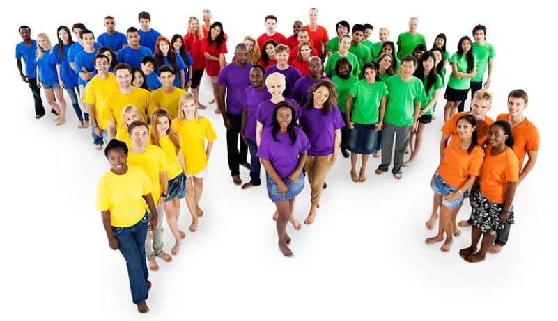 A group of (dressed) people, from various backgrounds and ethnicities