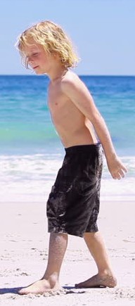 Boy with shorts at beach